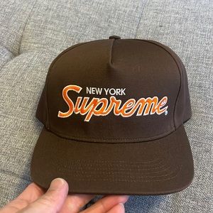 Supreme New York brown snap back hat.